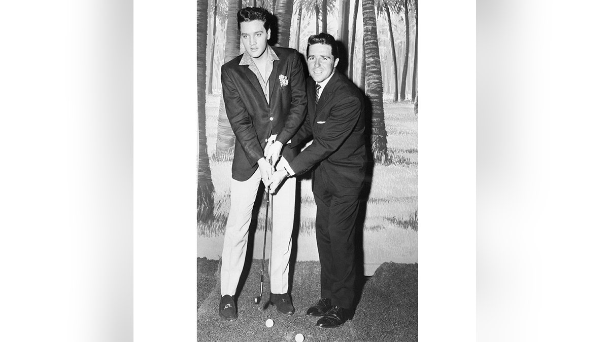 Elvis, seen here with Masters champion Gary Player, was not a big golfer.