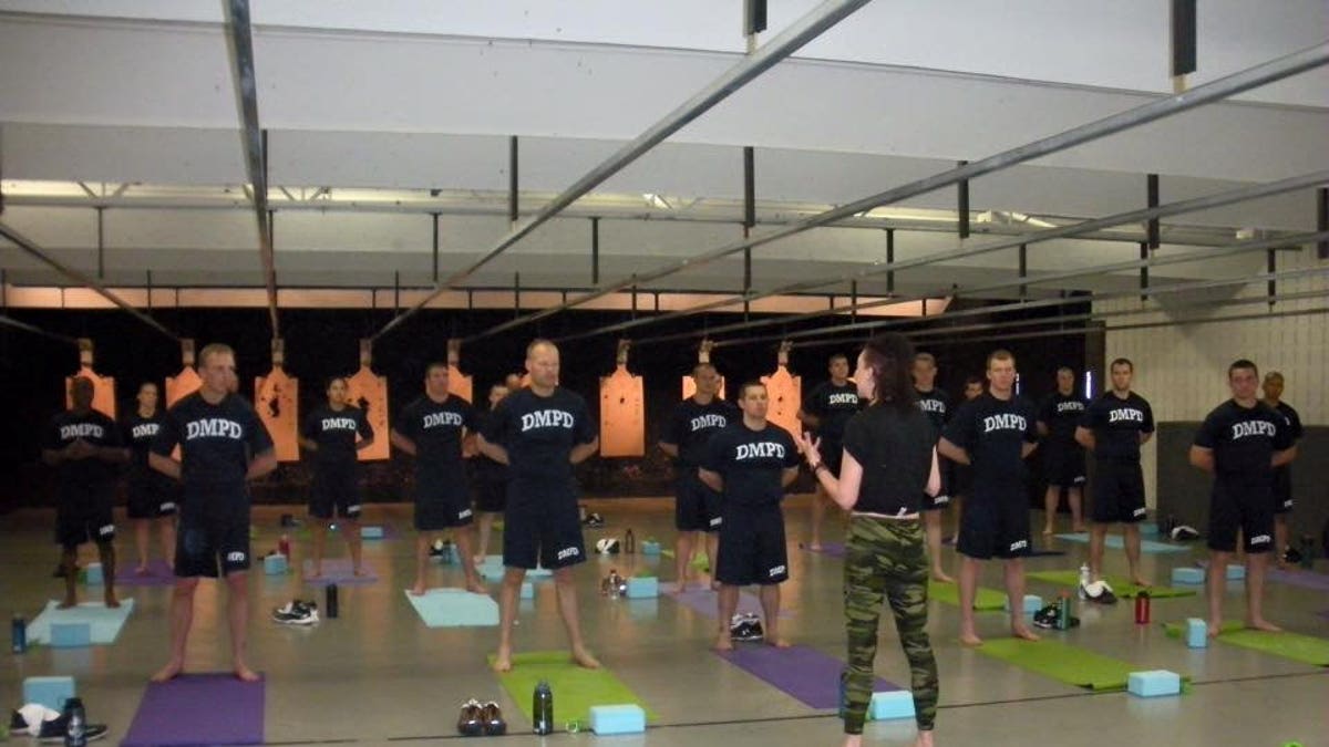 Police officers and firefighters are coping with the stress of life on the front line by practicing yoga.