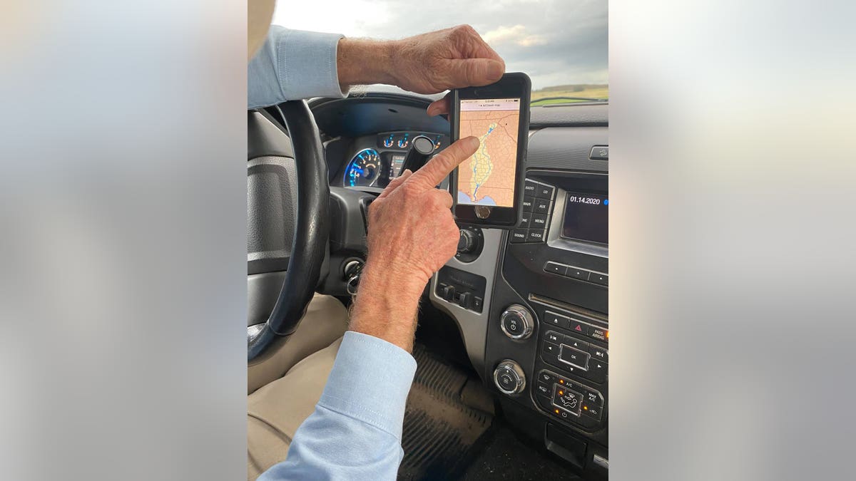 Farmer Murray Campbell shows the technology used to maintain and monitor water usage.