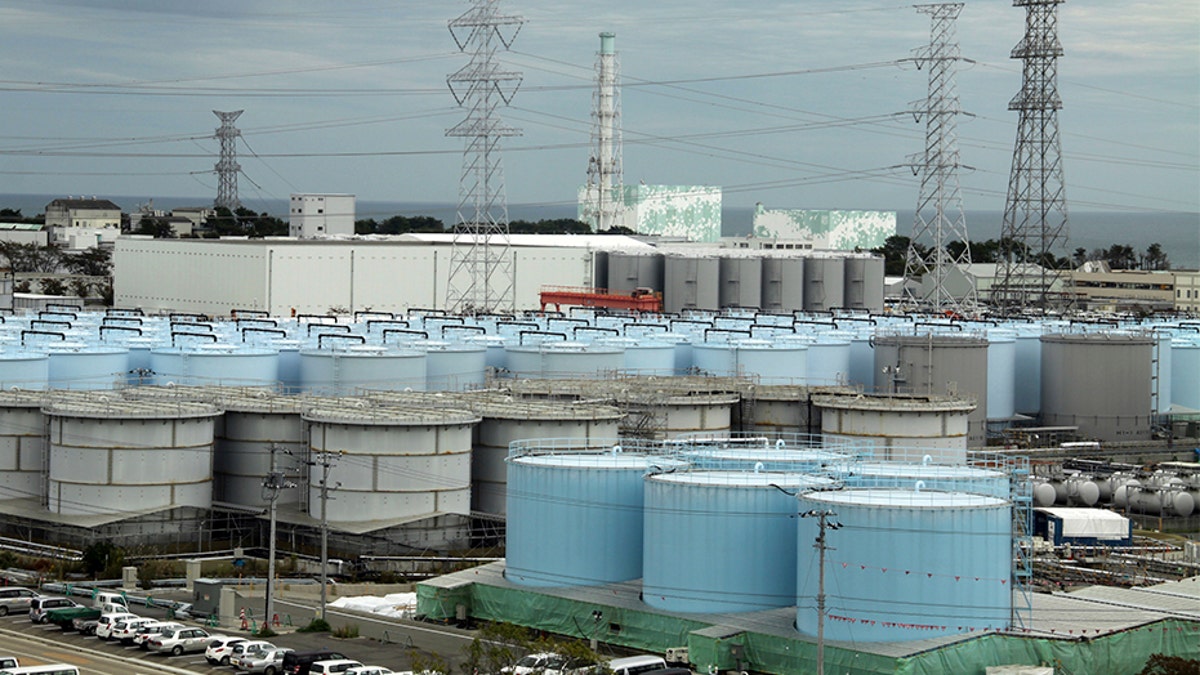 An ever-growing amount of contaminated, treated but still slightly radioactive, water at the wrecked Fukushima Dai-ichi nuclear plant is stored in about 900 huge tanks, including those seen in this photo taken during a plant tour in 2017. (AP)