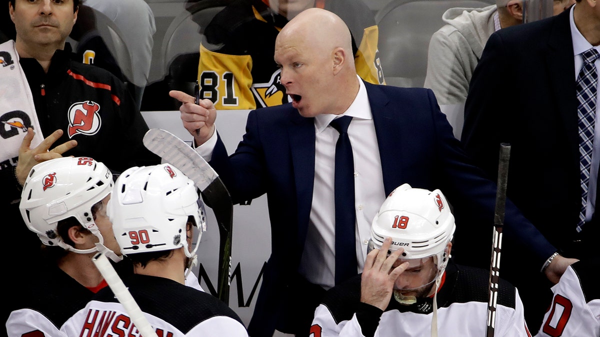 In this Jan. 28, 2019, file photo, then-New Jersey Devils head coach John Hynes gives instructions during the first period of an NHL hockey game against the Pittsburgh Penguins in Pittsburgh.  (AP Photo/Gene J. Puskar, File)
