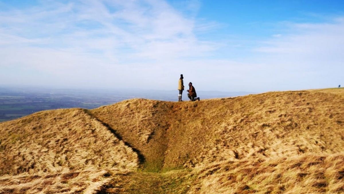 The woman captured the couple's special moment while she was out for a walk with her family.