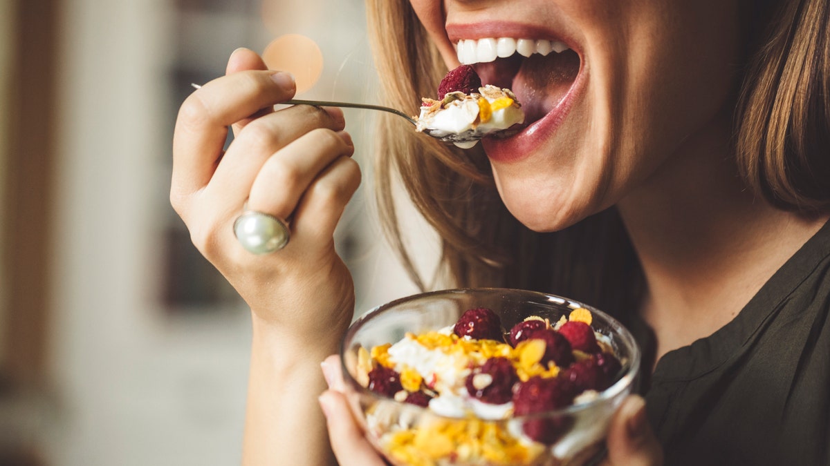 Woman eating parfait