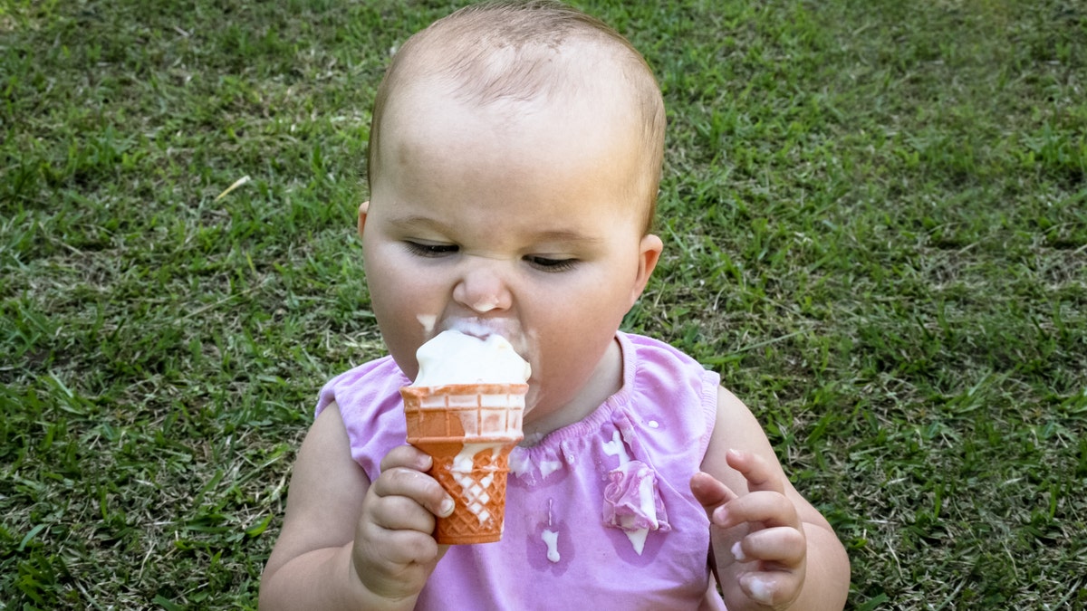 baby eats ice cream