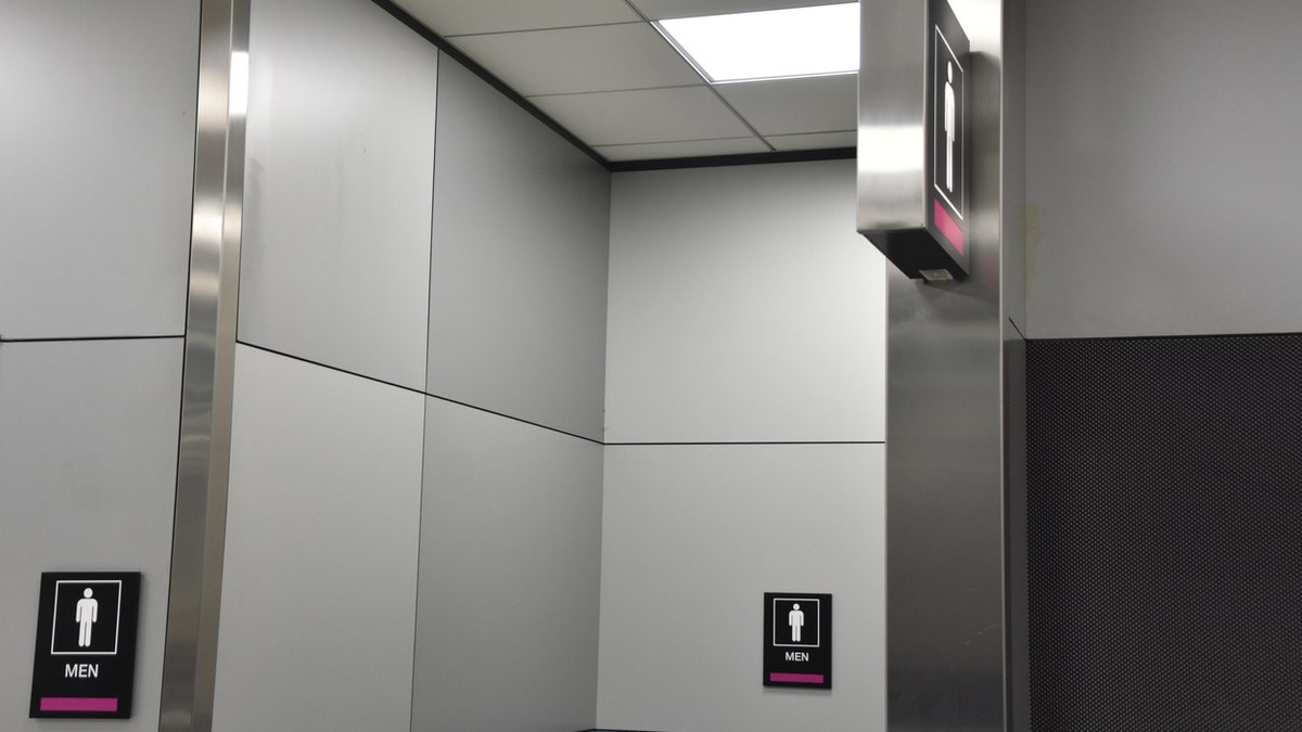 The drunken passenger went to the bathroom and locked himself in a stall where he continued to drink and smoke. He later asked police to just “take him to jail.”
