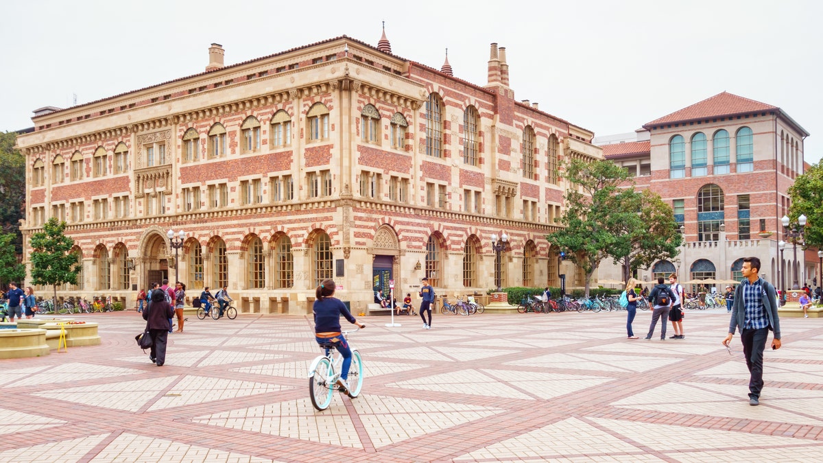 Students walk and bike at the University of Southern California campus in Los Angeles. (iStock)