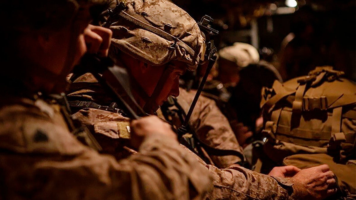 In this photo provided by U.S. Department of Defense, U.S. Marines prepare to deploy from Kuwait on Dec. 31. (AP/U.S. Marine Corps/Sgt. Robert G. Gavaldon)