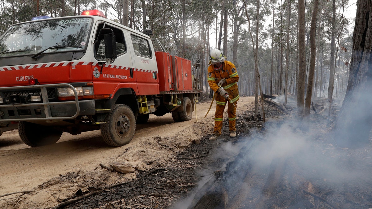 Authorities are using relatively benign conditions forecast in southeast Australia for a week or more to consolidate containment lines around scores of fires that are likely to burn for weeks without heavy rainfall. (AP Photo/Rick Rycroft)