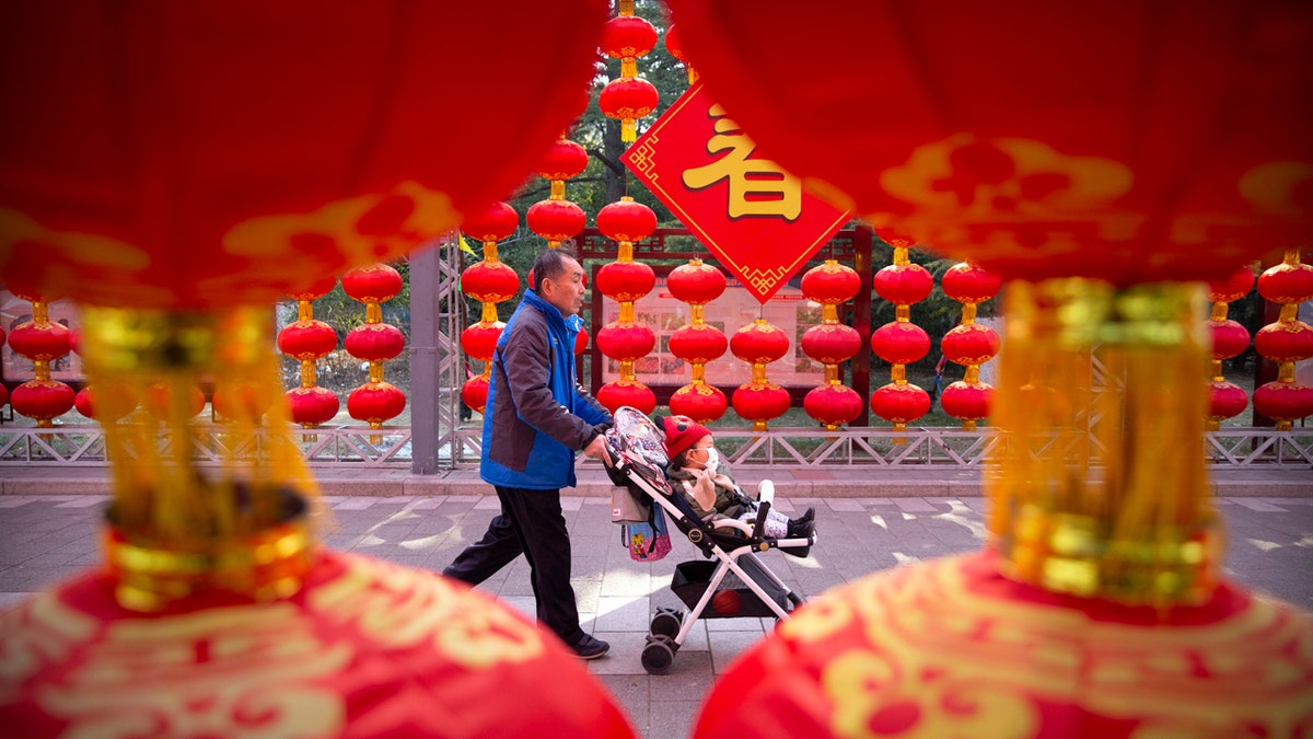 China's most festive holiday began in the shadow of a worrying new virus Saturday as the death toll grew, an unprecedented lockdown kept 36 million people from traveling and authorities canceled a host of Lunar New Year events.