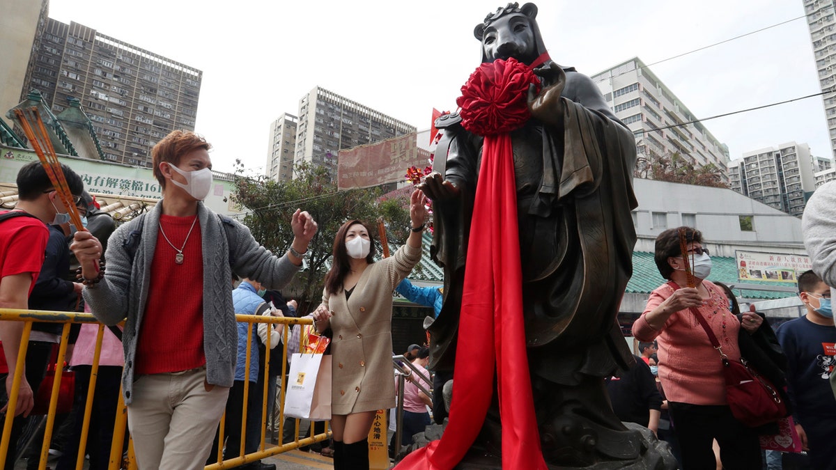 China's most festive holiday, the Lunar New Year, began in the shadow of a worrying new virus as the death toll grew, an unprecedented lockdown kept 36 million people from traveling and authorities canceled a host of Lunar New Year events.
