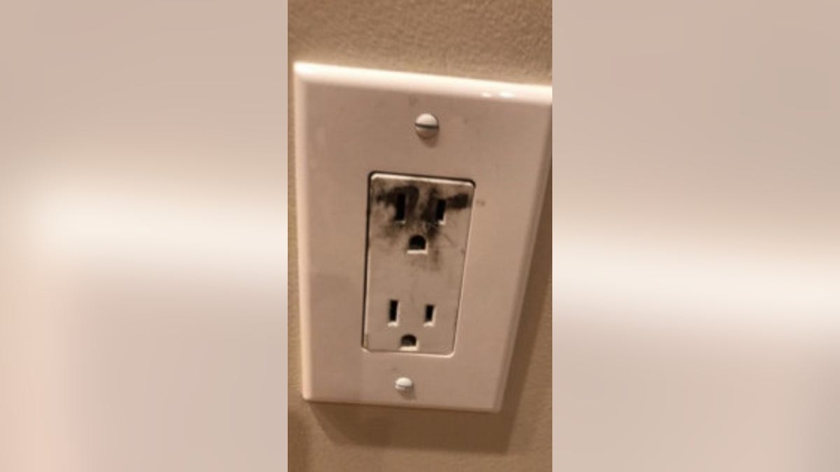 A scorch mark is seen on an electrical outlet after an "outlet challenge" incident. (Massachusetts Fire Marshal)