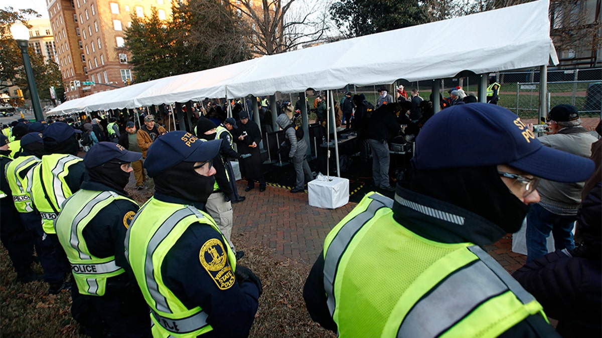 Virginia State troopers stand near a security checkpoint at the Capitol grounds in Richmond. (AP)