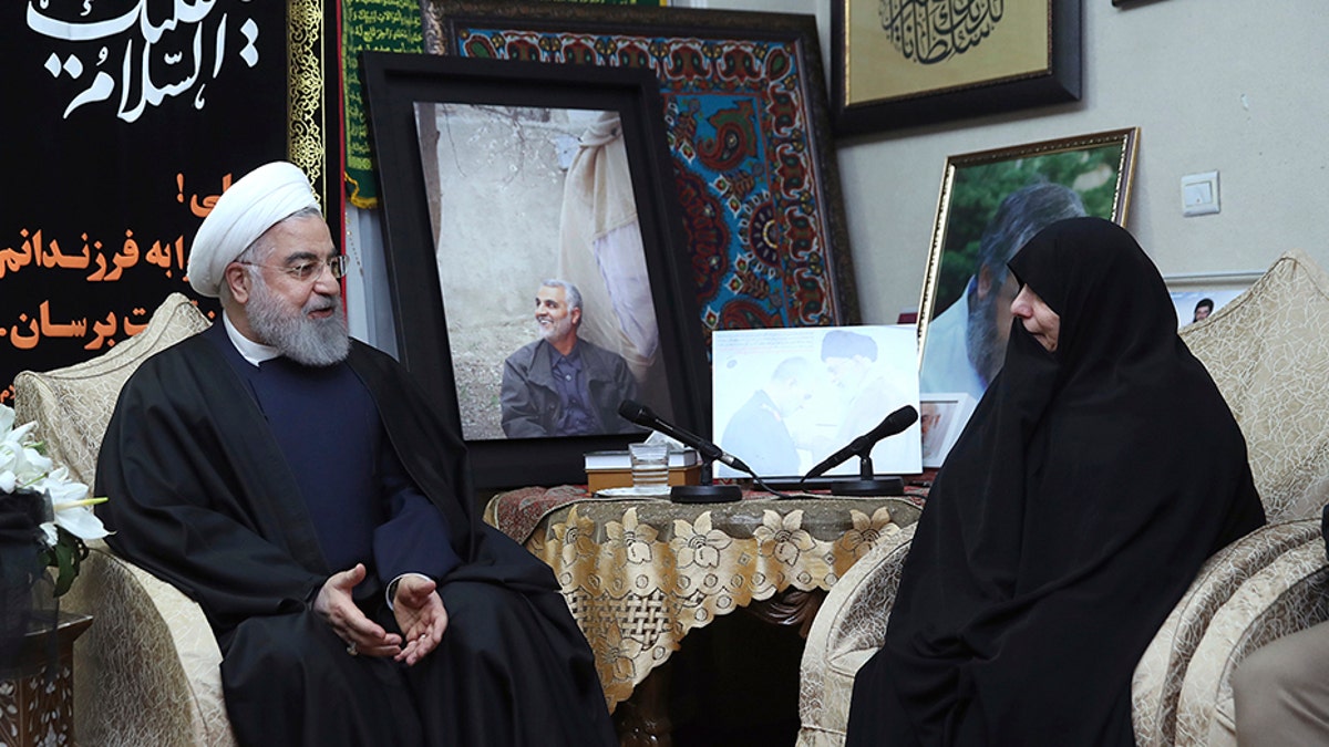 Iranian President Hassan Rouhani, left, meets family of Iranian Revolutionary Guard Gen. Qassem Soleimani, who was killed in the U.S. airstrike in Iraq, at his home in Tehran, Iran, on Saturday.