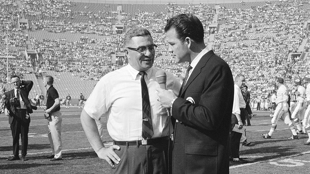 Vince Lombardi speaks to CBS Sports commentator Frank Gifford during the first Super Bowl on Jan. 15, 1967. (Photo by CBS via Getty Images)