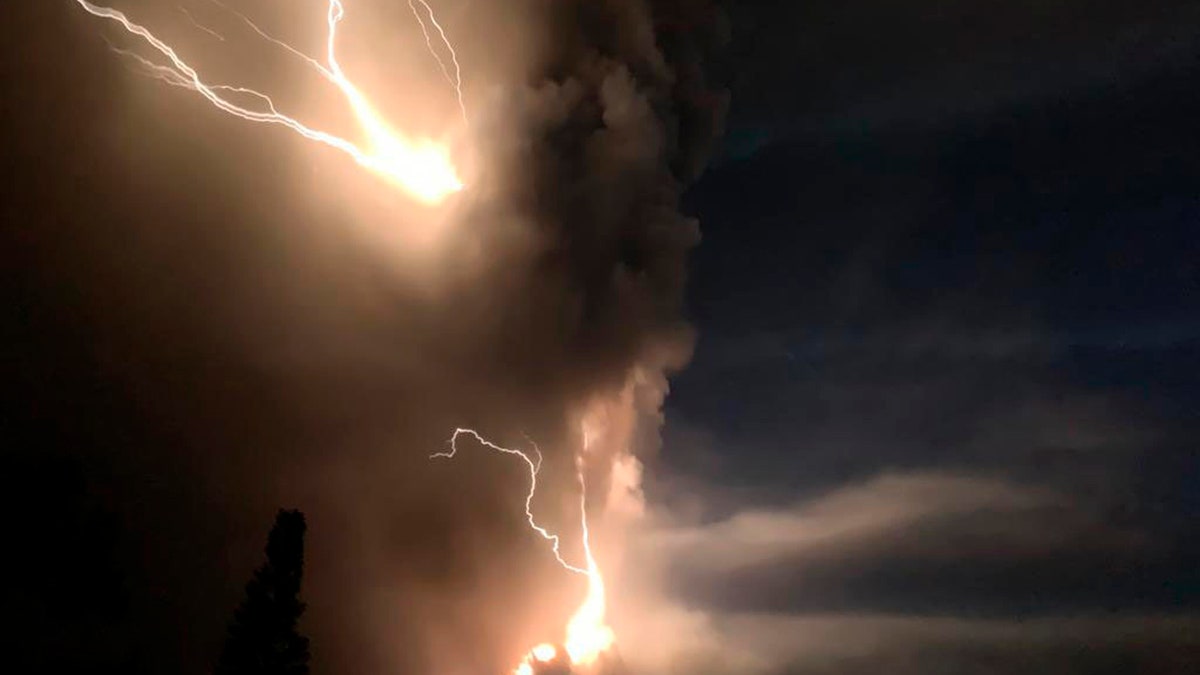 Lightning flashes as Taal Volcano erupts Sunday Jan. 12, 2020, in Tagaytay, Cavite province, outside Manila, Philippines.