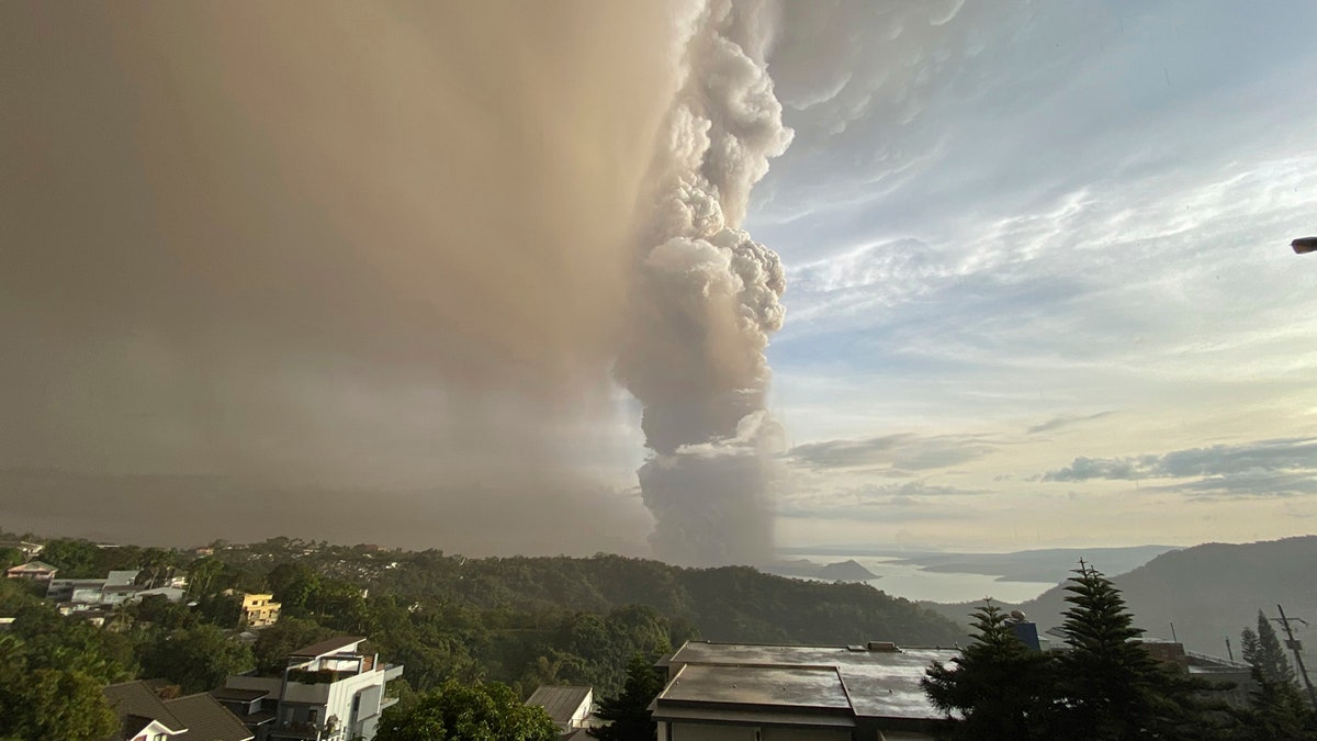 Plumes of smoke and ash rise from as Taal Volcano erupts Sunday Jan. 12, 2020, in Tagaytay, Cavite province, outside Manila, Philippines.
