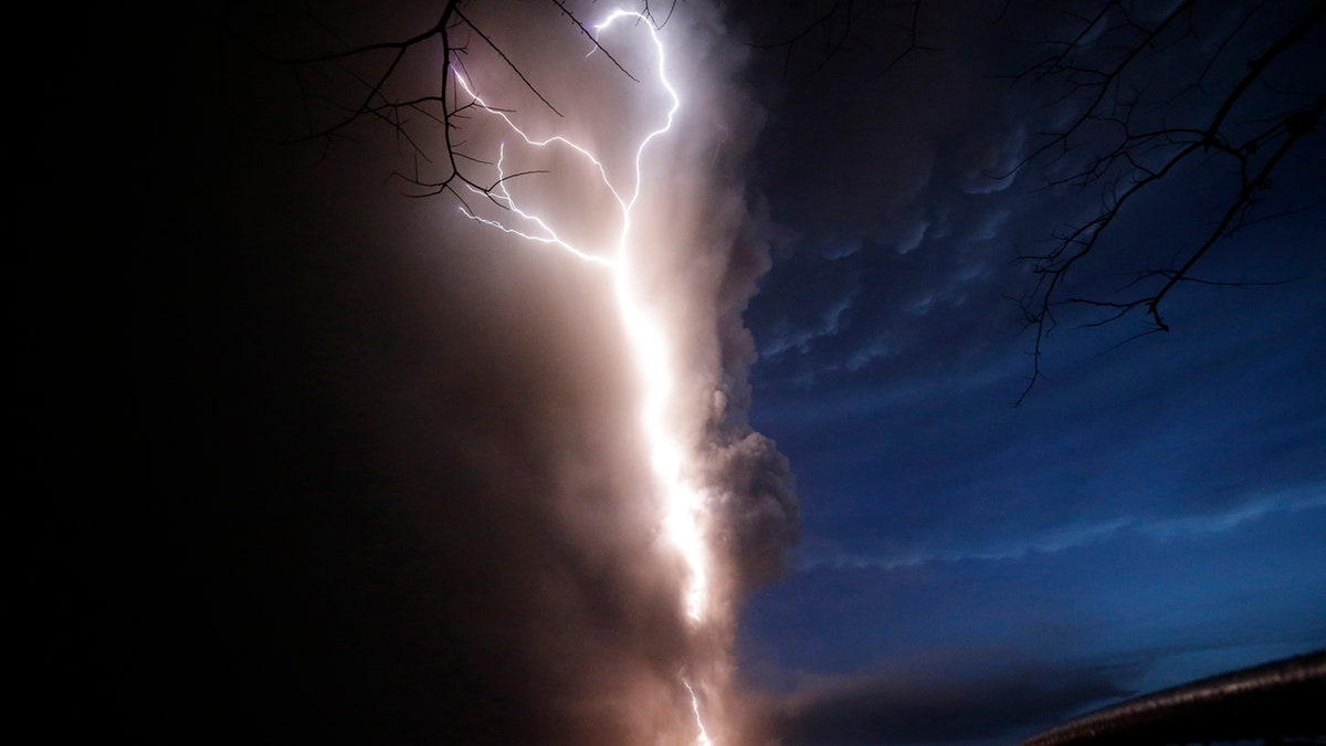 Lightning flashes as Taal Volcano erupts Sunday Jan. 12, 2020, in Tagaytay, Cavite province, outside Manila, Philippines.