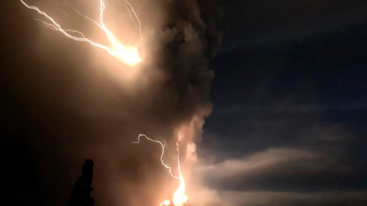 Lightning flashes as Taal Volcano erupts Sunday Jan. 12, 2020, in Tagaytay, Cavite province, outside Manila, Philippines.