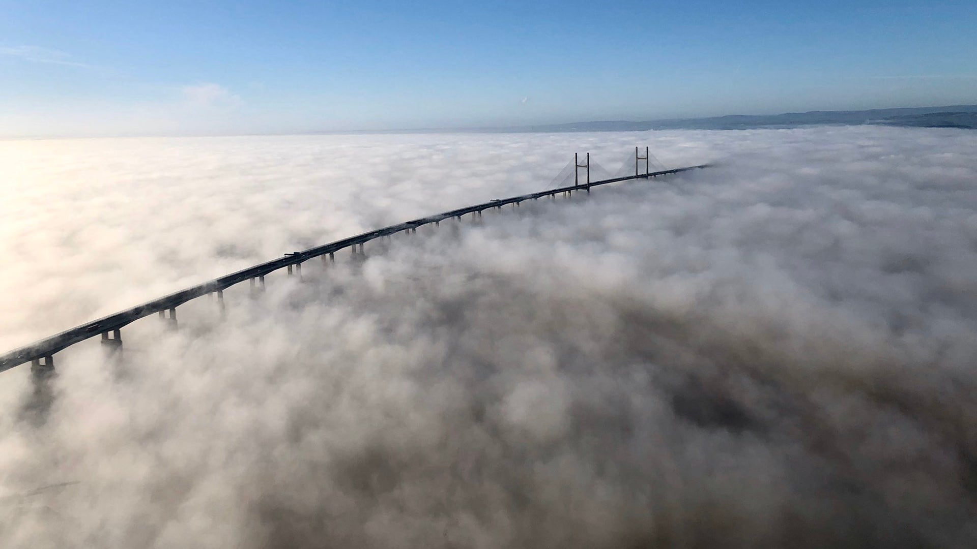 The Severn Bridge between England and Wales rises above a blanket of thick clouds hanging over the Severn Estuary, Jan 23, 2020.