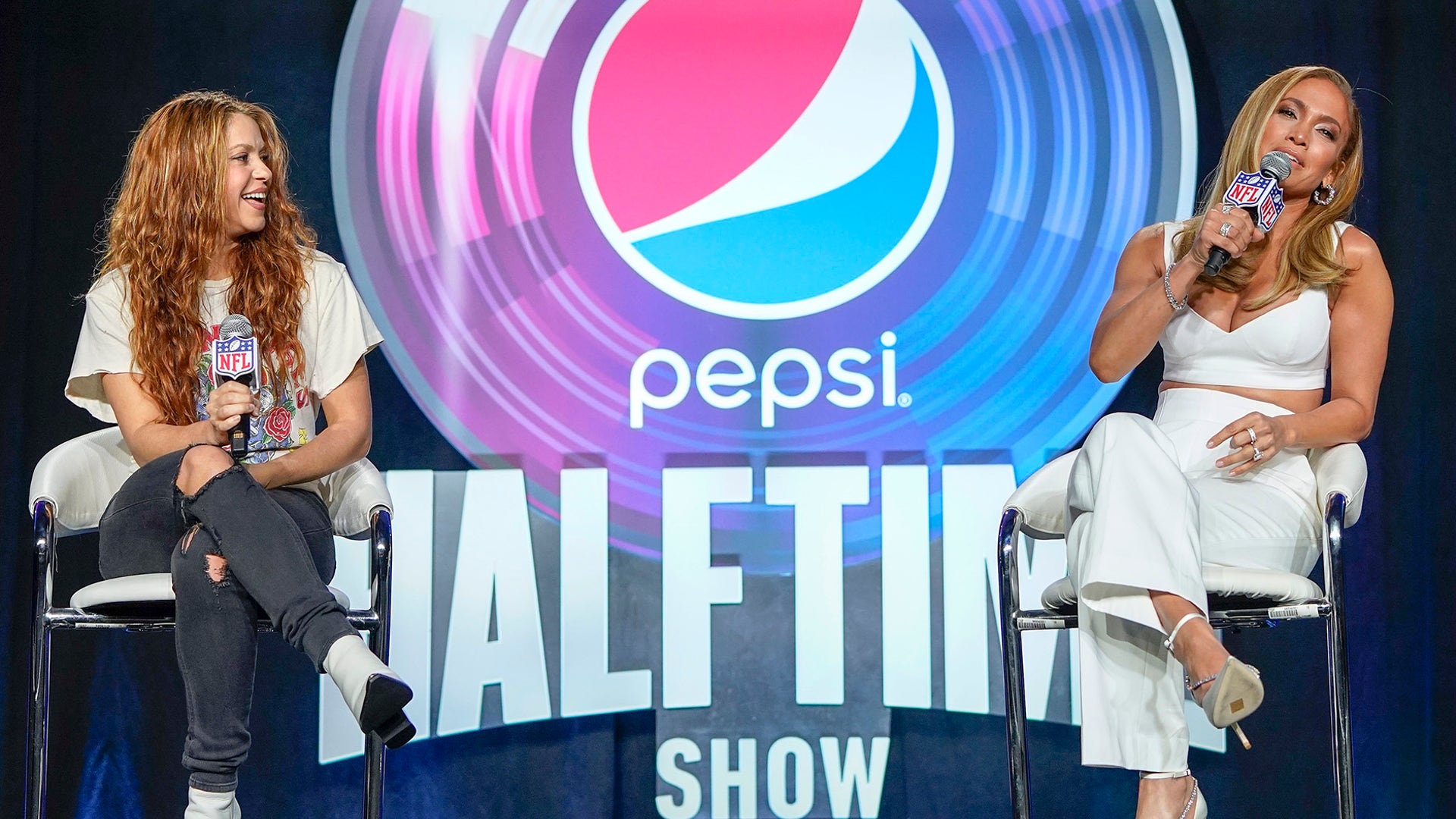NFL Super Bowl 54 football game halftime performer Jennifer Lopez and Shakira answer questions at a news conference, Jan. 30, 2020, in Miami.