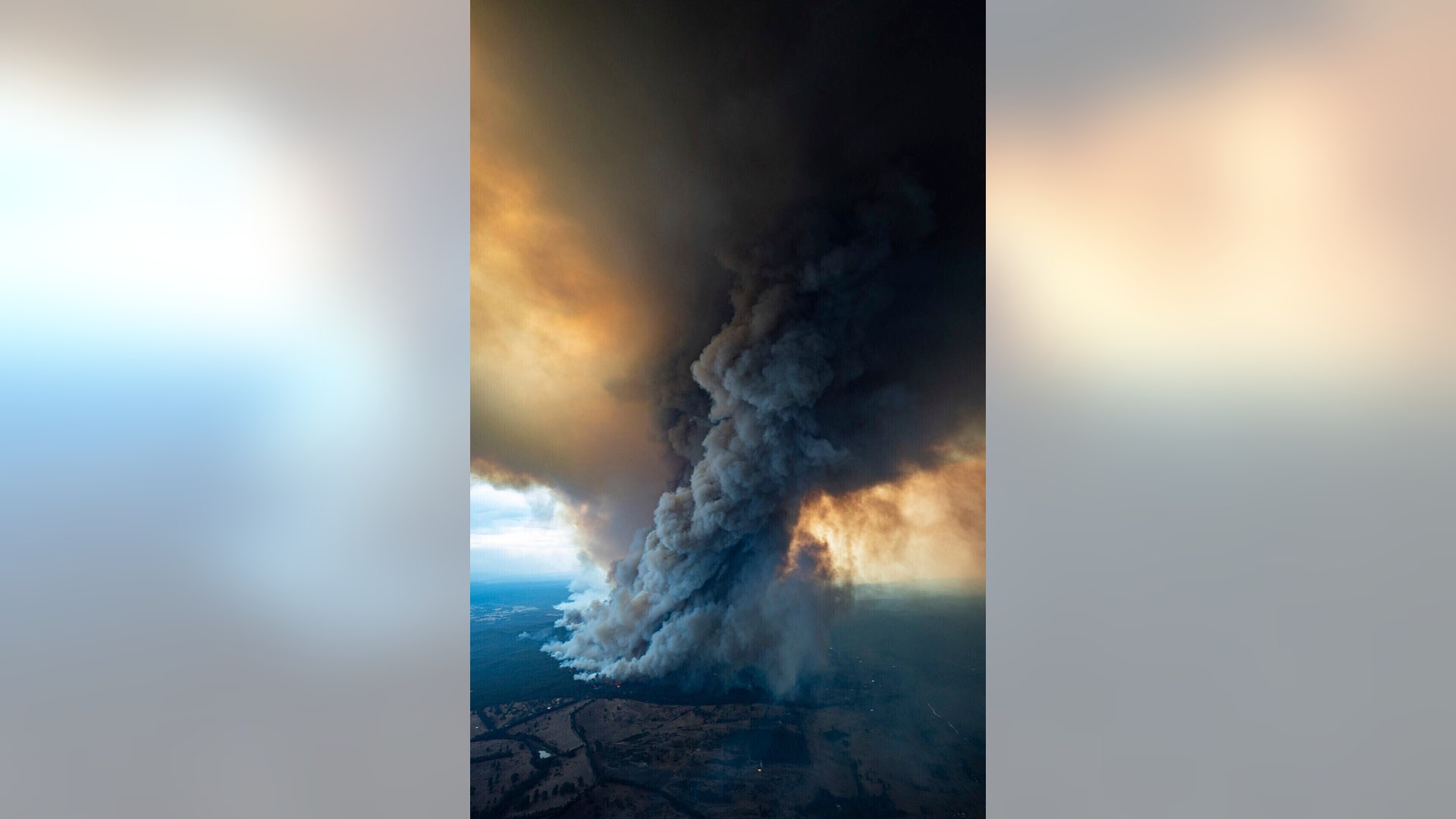 Smoke rises from wildfires burning in East Gippsland, Victoria, Australia, Jan. 2, 2020.