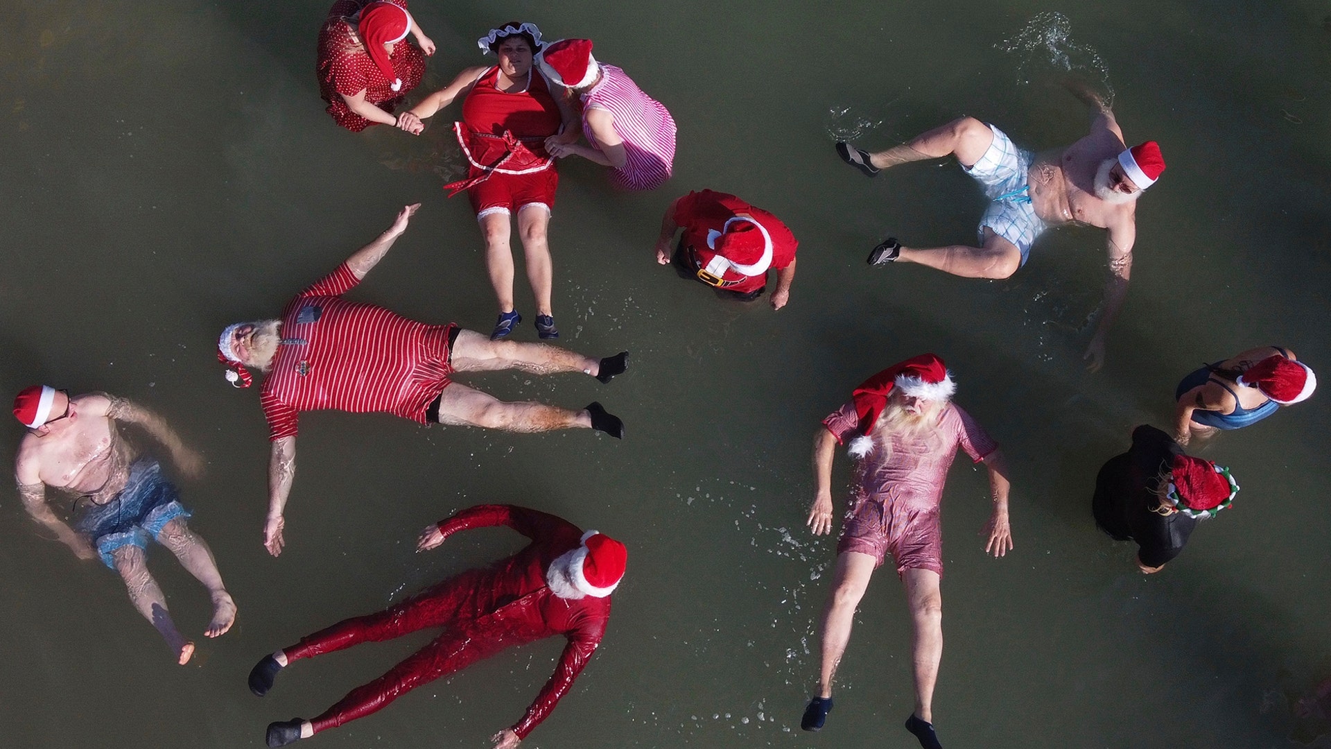 Members of a group of trained Santa Clauses from Europe and the USA float in the Dead Sea near the West Bank city of Jericho, Jan. 7, 2020. 