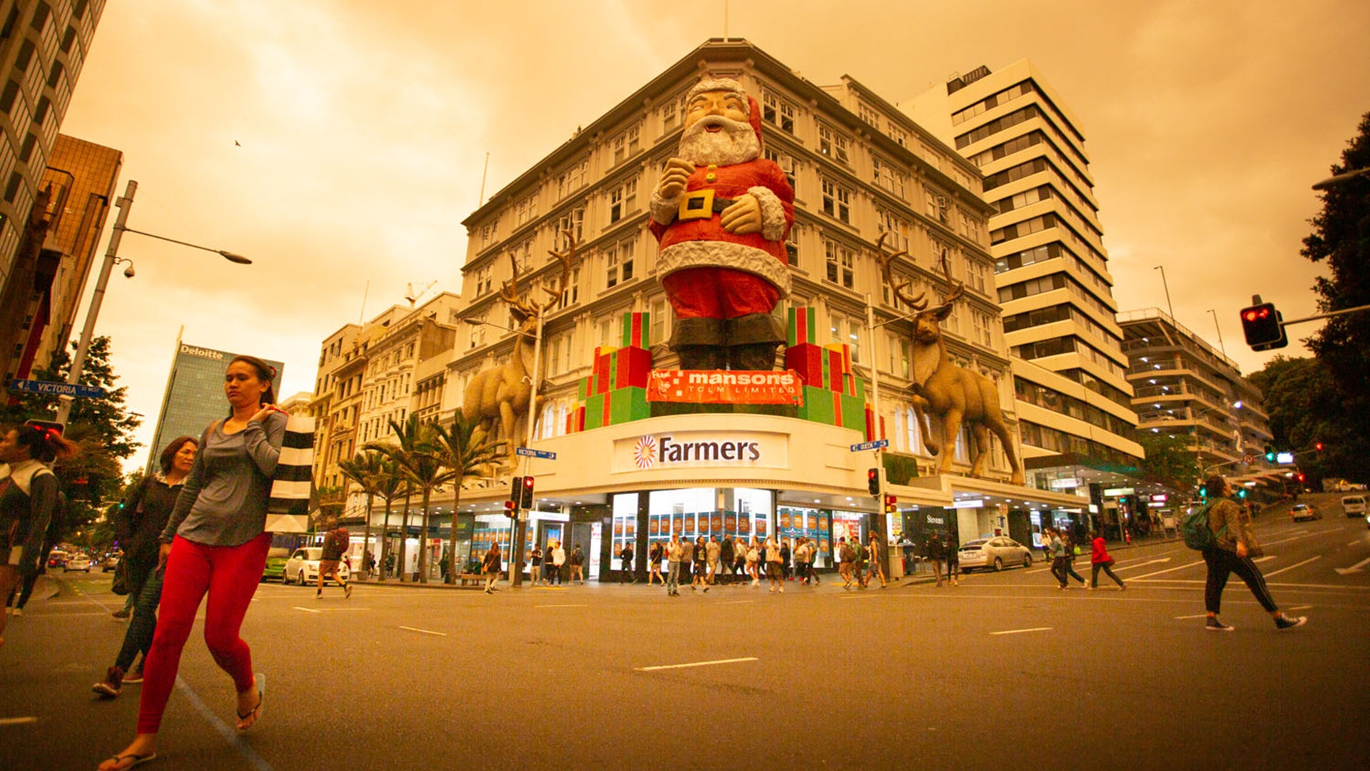 Queen Street, a main commercial thoroughfare, is pictured against an orange-colored sky as smoke generated by Australian bushfires hit Auckland, New Zealand, Jan. 5, 2020.