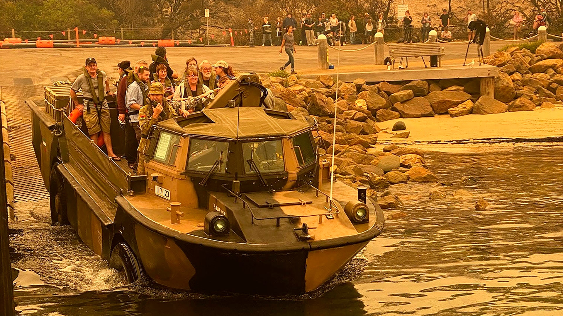 Evacuees are transported in a light amphibious resupply cargo transport amphibious vehicle from Mallacoota, Victoria, Australia, Jan. 2, 2020.