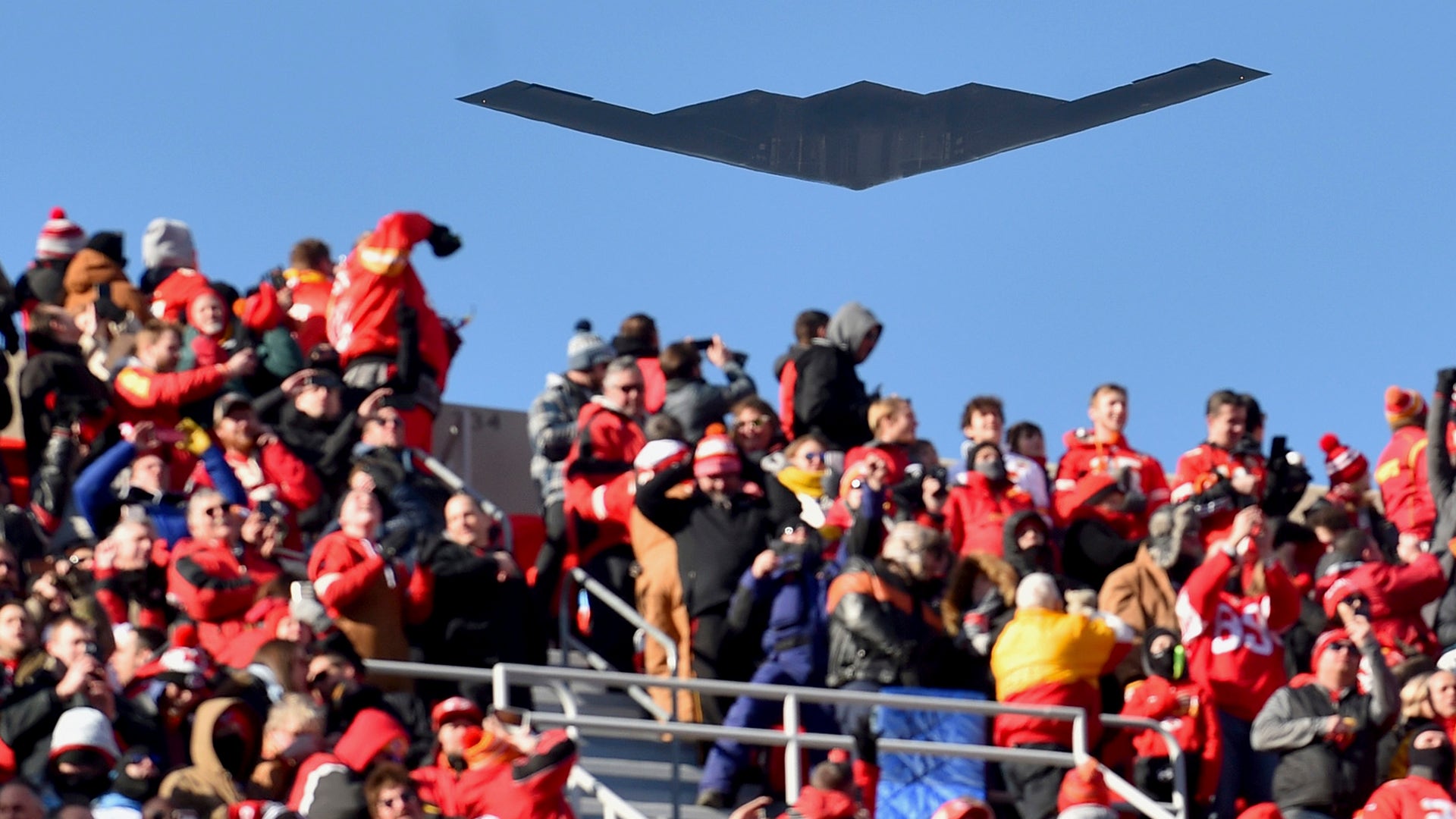 A B-2 bomber flies over spectators at Arrowhead Stadium before the AFC Championship football game between the Kansas City Chiefs and the Tennessee Titans, in Kansas City, Jan. 19, 2020.