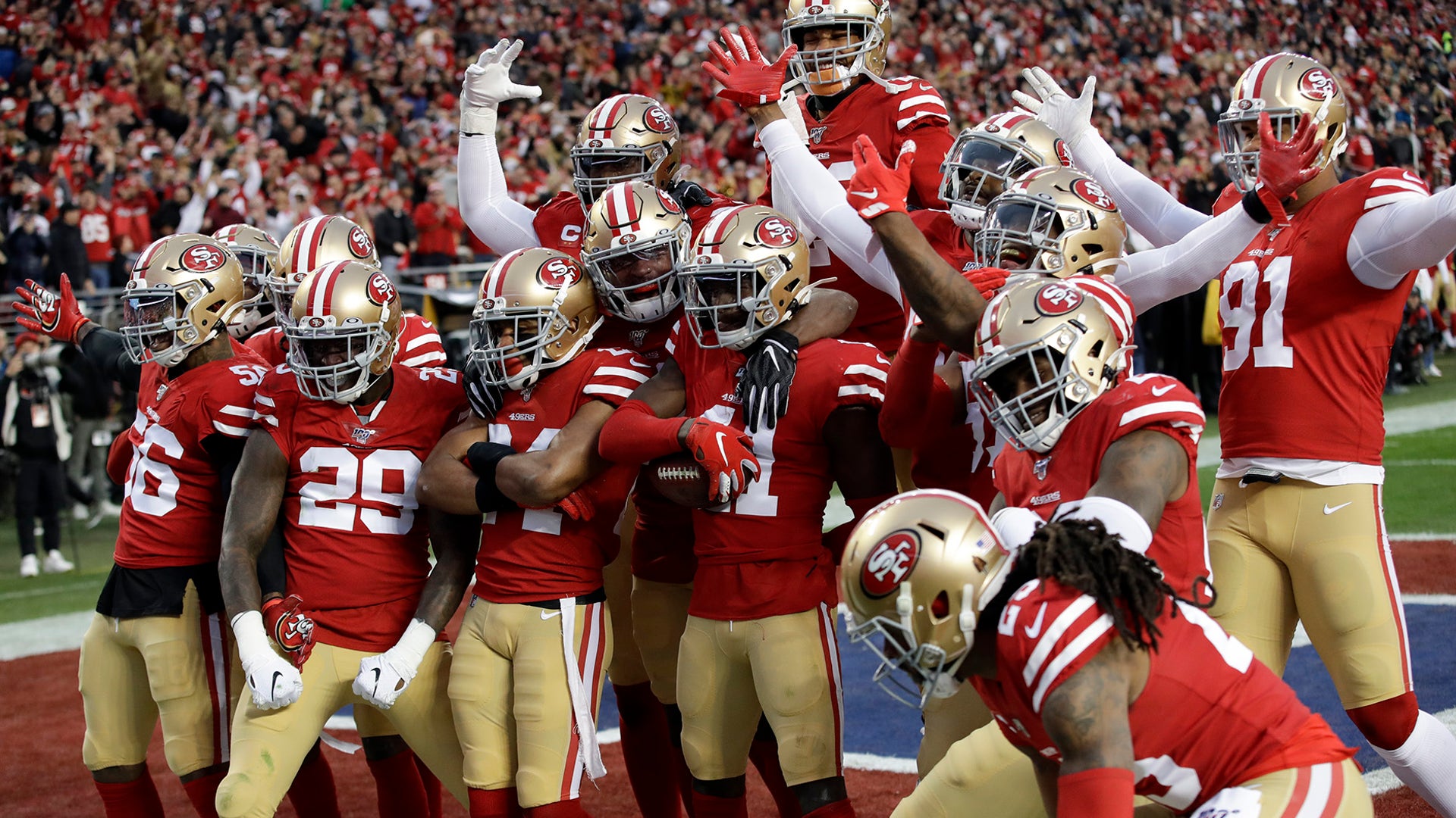The San Francisco 49ers celebrate after an interception by defensive back Emmanuel Moseley during the first half of the NFC Championship football game against the Green Bay Packers in Santa Clara, Jan. 19, 2020.