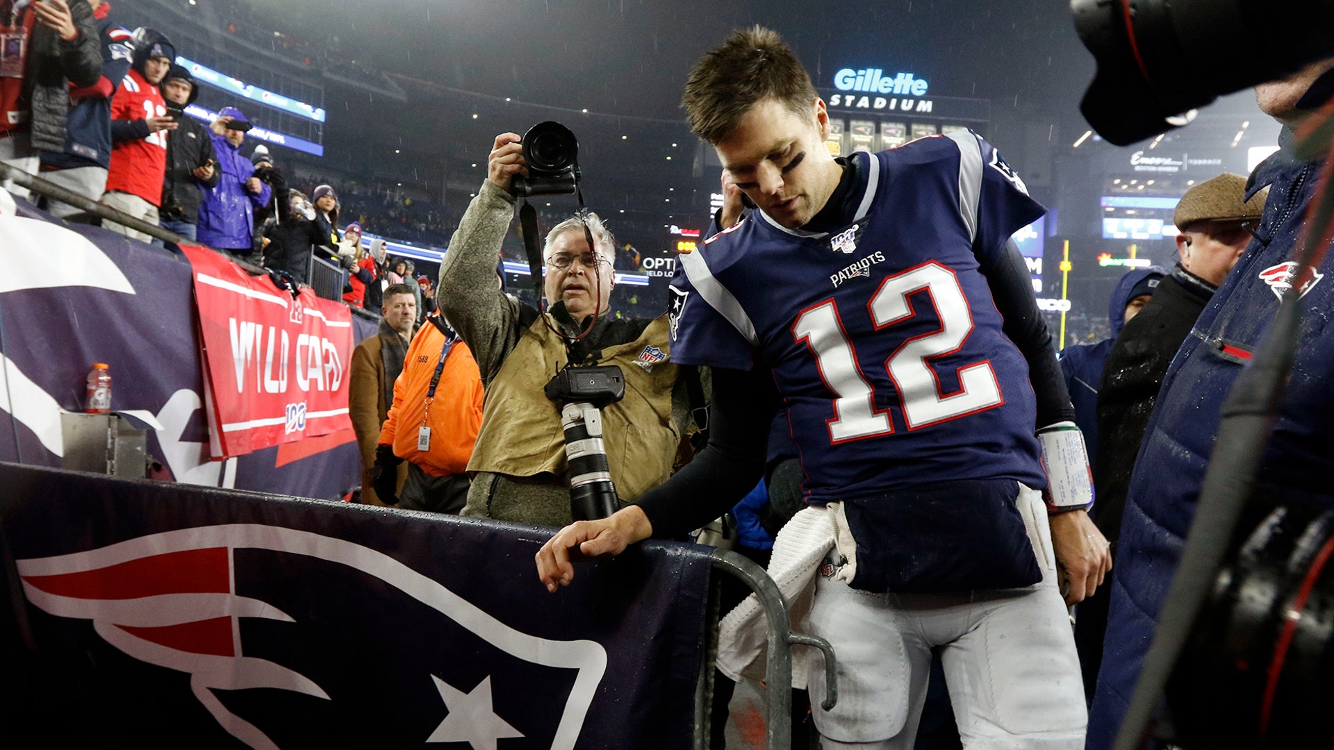 New England Patriots quarterback Tom Brady leaves the field after losing an NFL wild-card playoff football game to the Tennessee Titans, in Foxborough, Jan. 4, 2020.