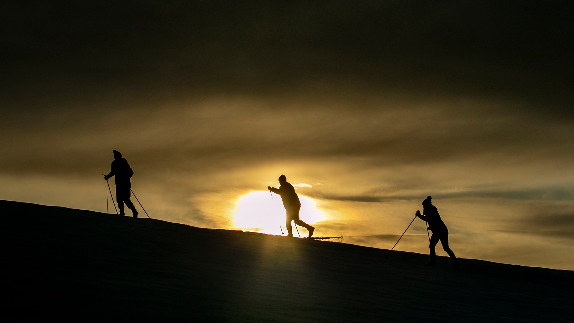 People make their way up a hill while cross-country skiing at Pineland Farms, Jan. 8, 2020.