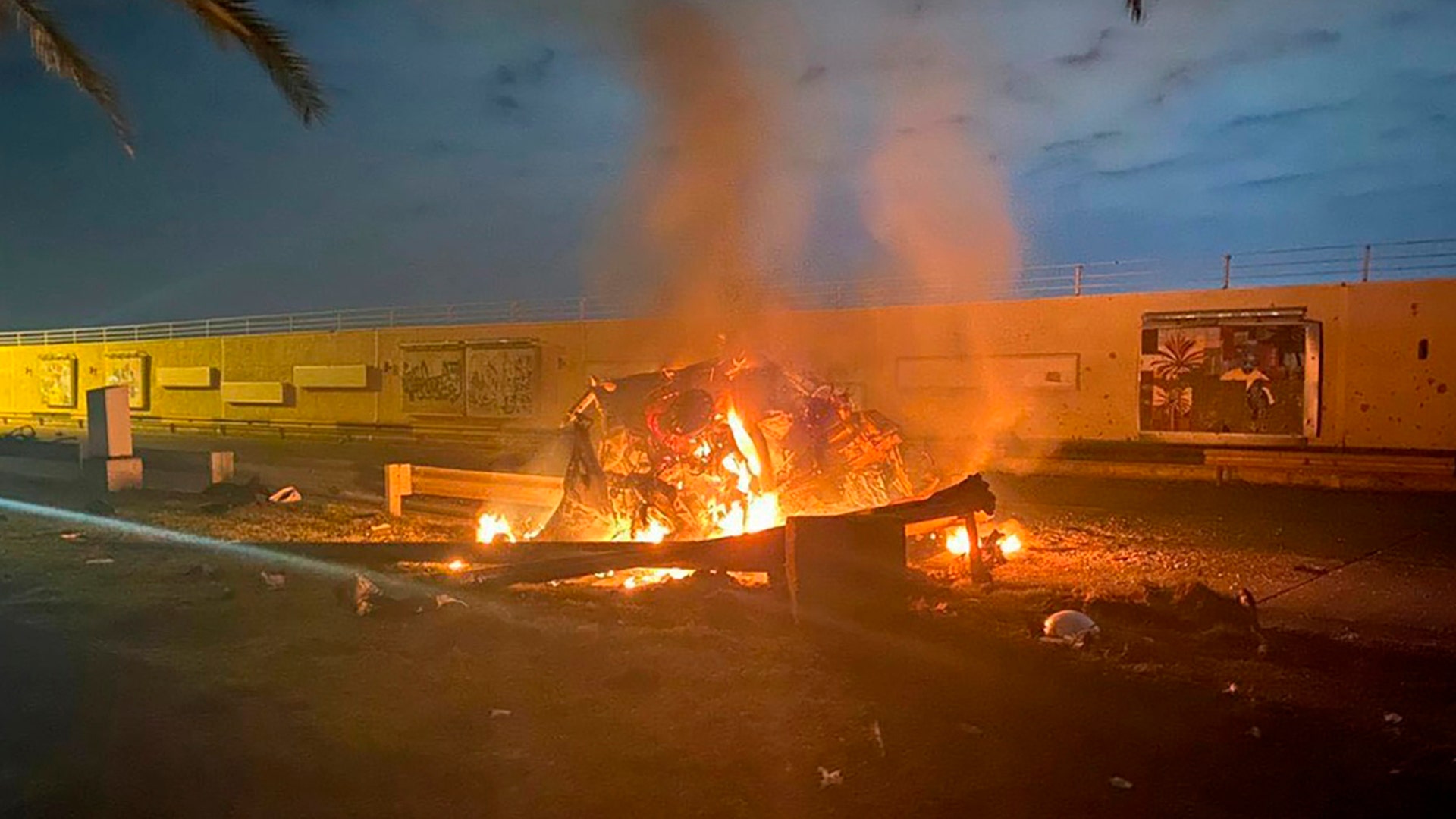 A vehicle burns at the Baghdad International Airport following an airstrike that killed Gen. Qassem Soleimani, the head of Iran's elite Quds Force in Baghdad, Iraq, Jan. 3, 2020.