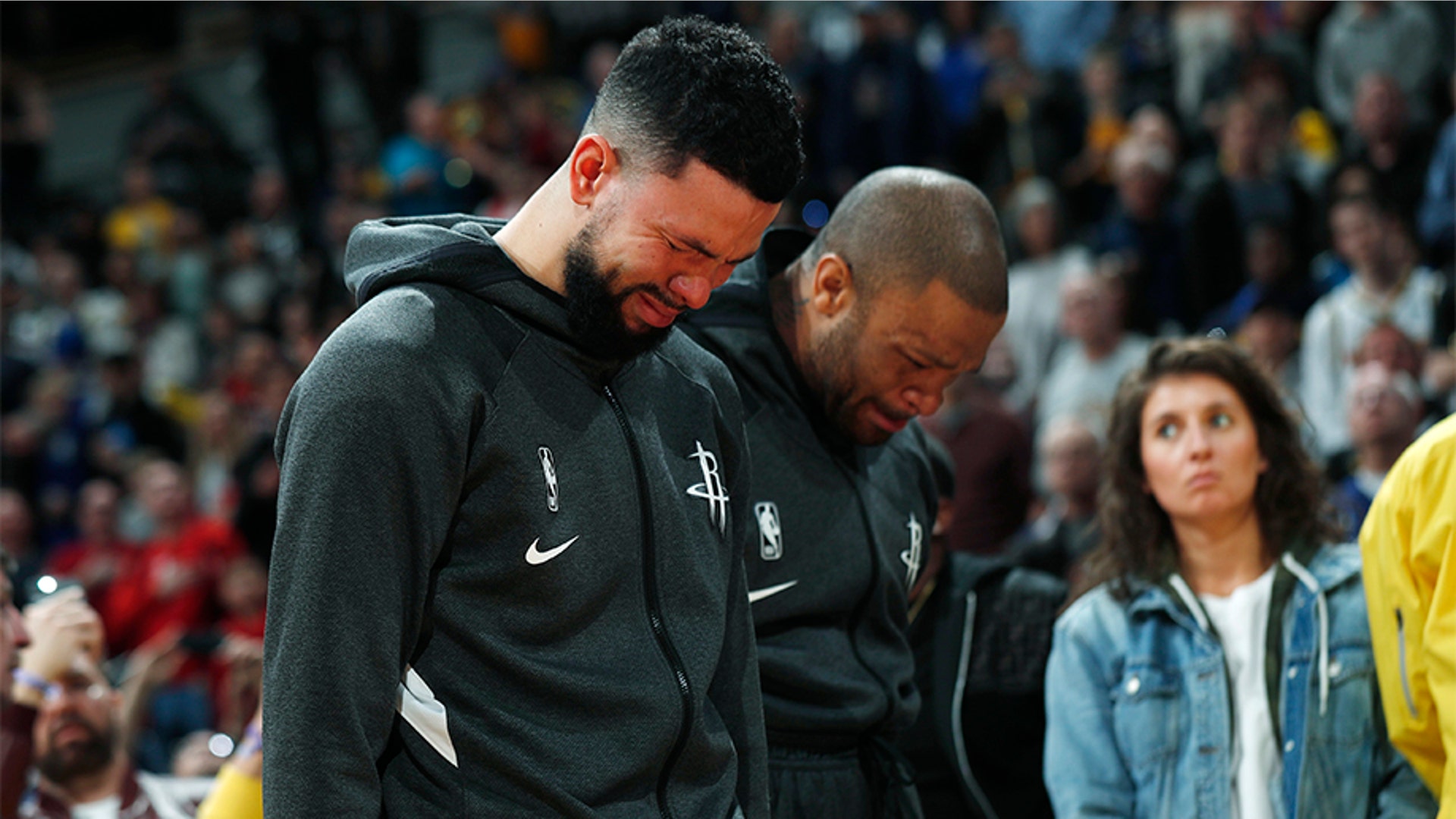 Houston Rockets guard Austin Rivers and forward P.J. Tucker react during a tribute to Bryant.