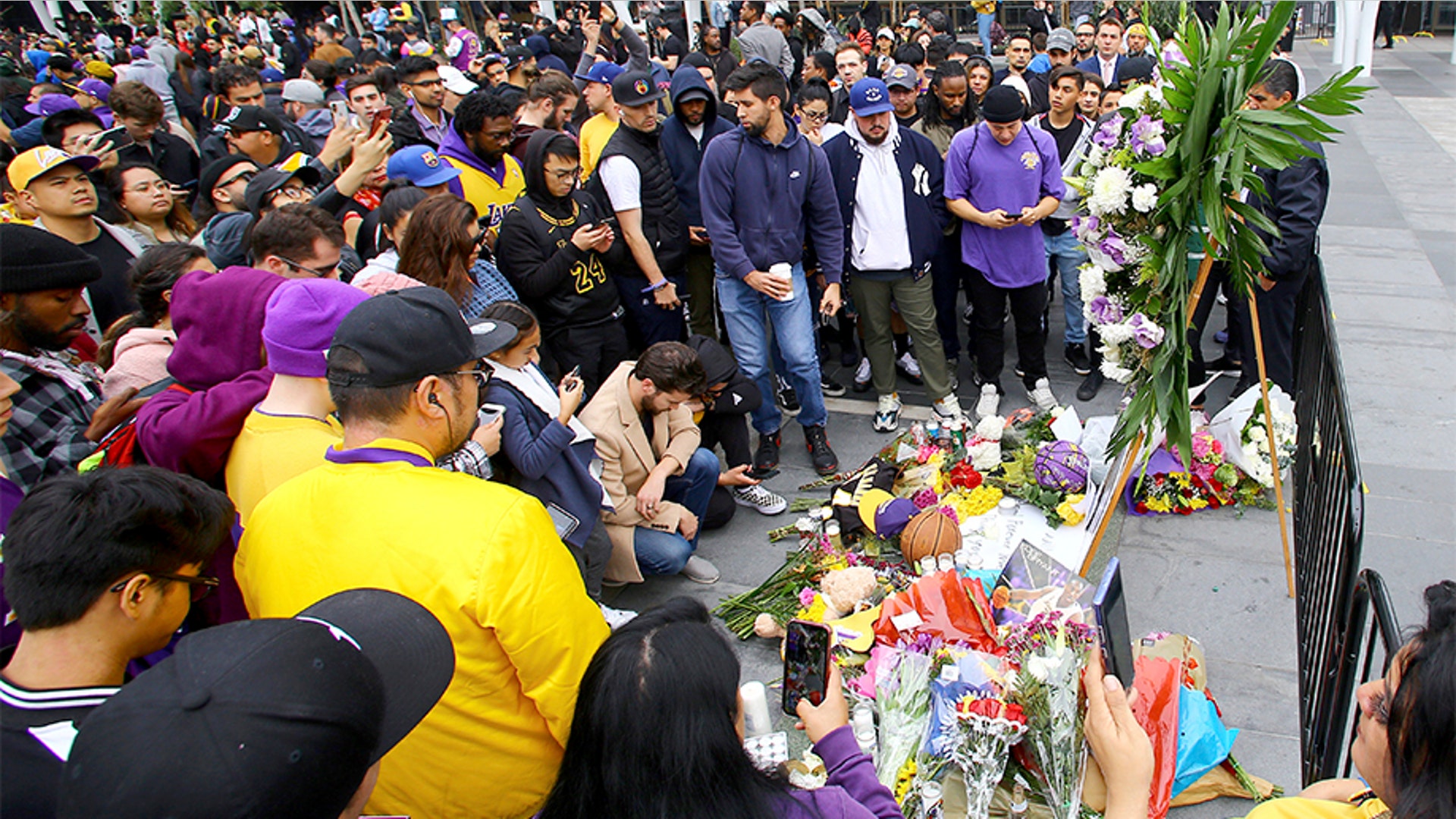 Fans of Kobe Bryant mourn at LALive area across from Staples Center, home of the Los Angeles Lakers.