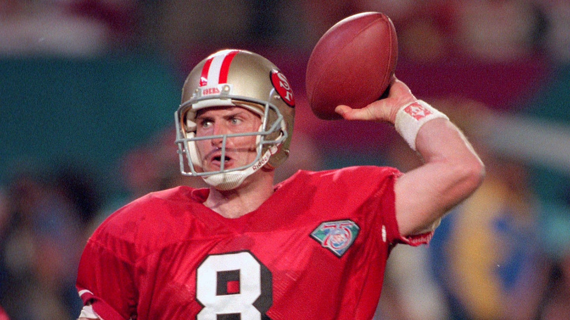 Jan. 29, 1995, Miami: Steve Young, #8 of the San Francisco 49ers, drops back to pass against the San Diego Chargers during Super Bowl XXIX at Joe Robbie Stadium. The Niners won the Super Bowl 49-26.