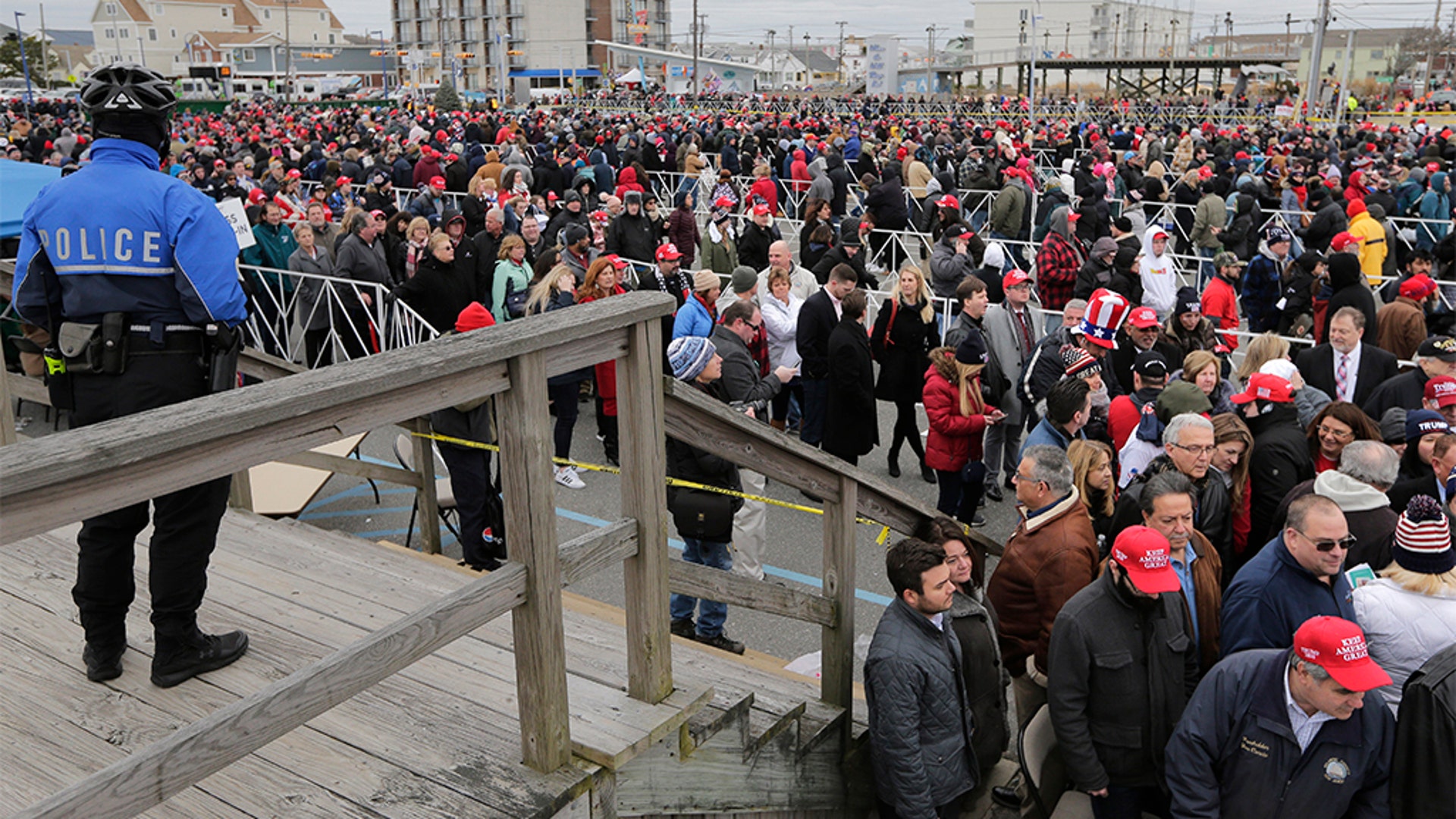 People standing in line to get into the rally.