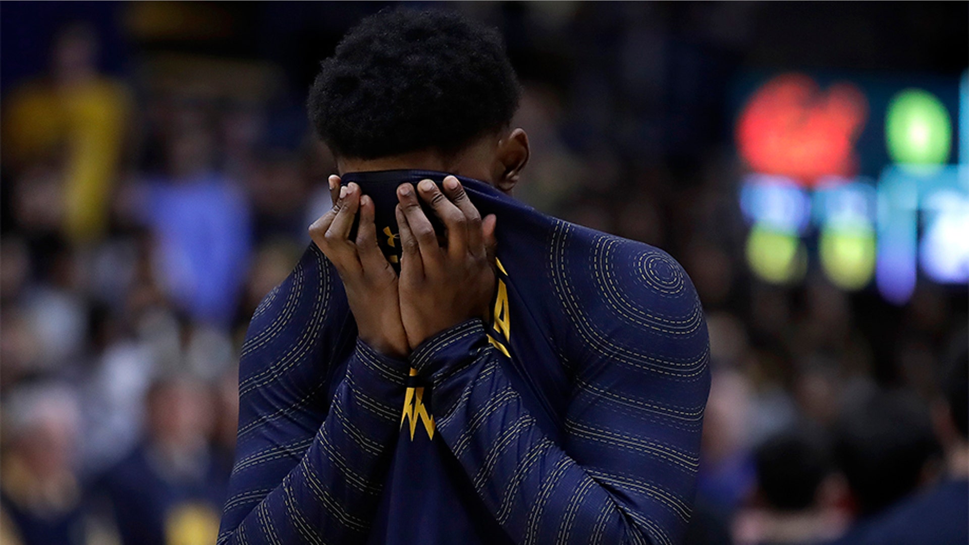 California's D.J. Thorpe covers his face during a moment of silence for Kobe Bryant.
