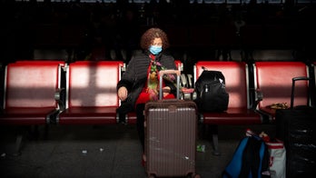 Coronavirus vaccine in 'early stages' as focus turns to China's transparency