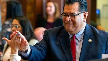 Illinois ex-lawmaker charged with bribery in red-light camera program