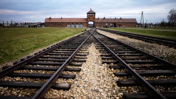 Woman's seductive pose at Auschwitz prompts outrage, response from museum demanding respect