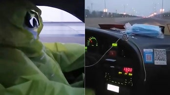 Coronavirus fears sees taxi driver don hazmat suit, goggles to pick up passenger
