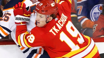 Calgary Flames' Matthew Tkachuk delivers huge hit on Edmonton Oilers' Zack Kassian, sparking brawl