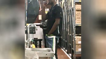 McDonald's worker pictured with his hand stuck down his pants