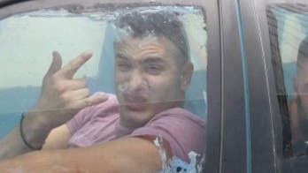 YouTube prankster appears in Australian court for 'scuba driving' flooded car to liquor store in viral video