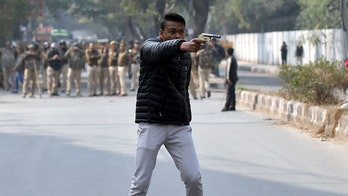 Man pictured brandishing gun at protest against India's citizenship law, injures one