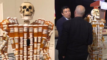 Skeleton ‘pill man’ confronts presidential candidates about opioid epidemic