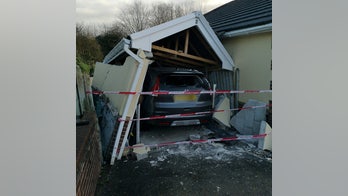 Driver destroys their own garage while parking in it