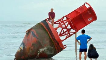 Big red buoy removed from Florida beach after sitting there for days