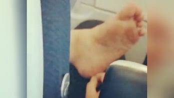 Social media shocked by video of airplane passenger picking dead skin off bare foot
